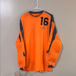 Used goalie shirt. Adult size medium.